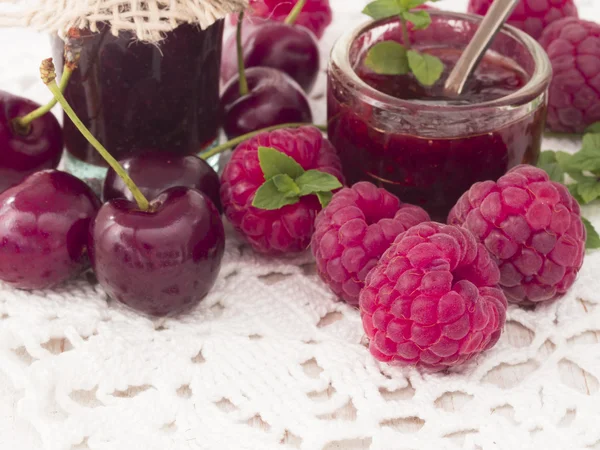 Jam made of raspberries and cherries — Stock Photo, Image