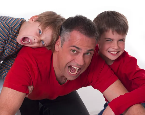 Spoiled children on their father's back, challeges od parenting — Stock Photo, Image