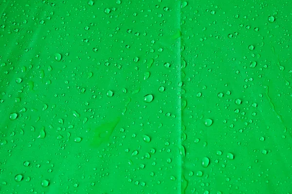 Gotas de agua sobre lienzo verde —  Fotos de Stock
