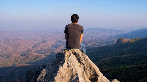 Man on rock at mountain — Stock Photo, Image