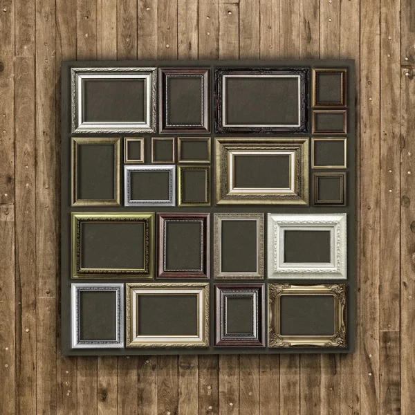 Antique frame on wood background — Stock Photo, Image