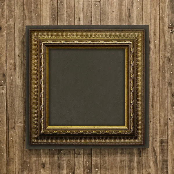 Antique frame on wood background — Stock Photo, Image