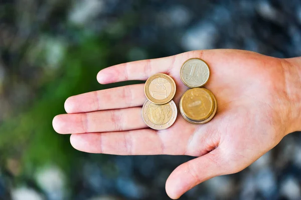 Coins in the palm of — Stock Photo, Image
