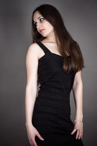 Brunette in a black dress — Stock Photo, Image