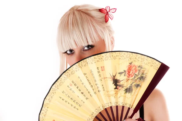 Beautiful oriental woman with a fan — Stock Photo, Image