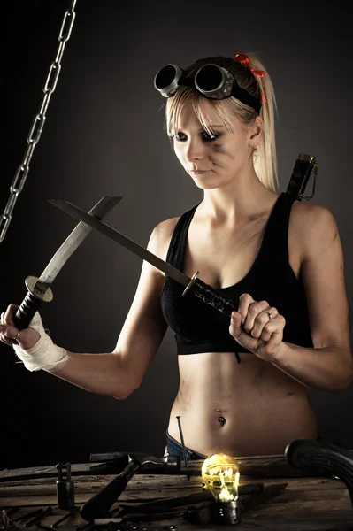 Beautiful woman with a sword — Stock Photo, Image
