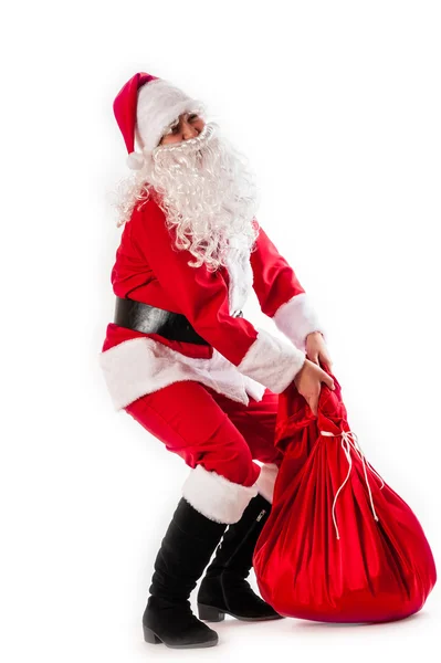 Santa Claus and a heavy bag — Stock Photo, Image