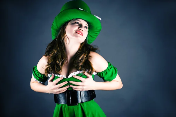 Woman dressed as leprechaun isolated on gray — Stock Photo, Image