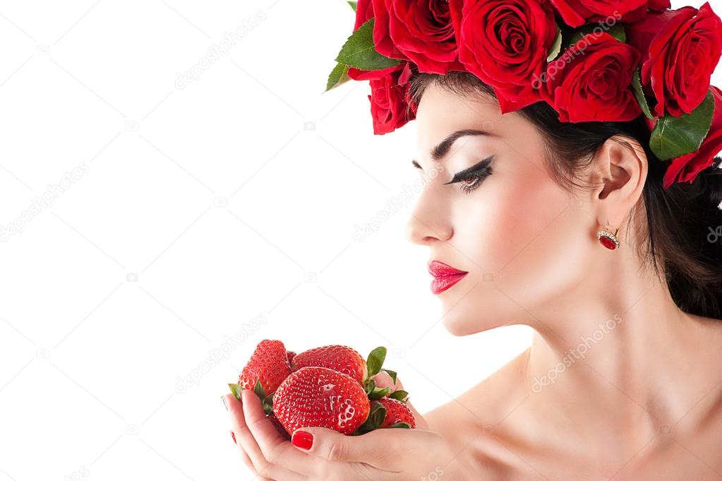 Beautiful fashion model with red roses hairstyle