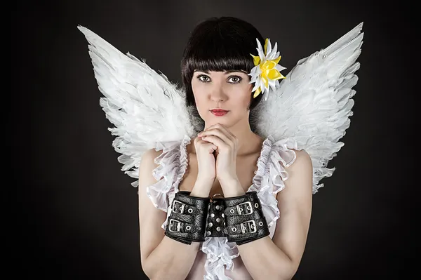 Woman in an image of an angel shackled — Stock Photo, Image