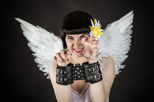 Woman in an image of an angel shackled — Stock Photo, Image