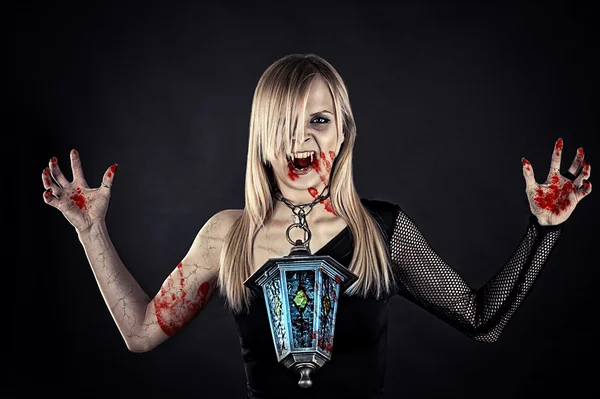 Bloody vampire with a lantern — Stock Photo, Image