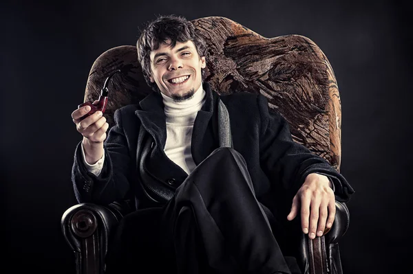 Successful businessman in a chair — Stock Photo, Image