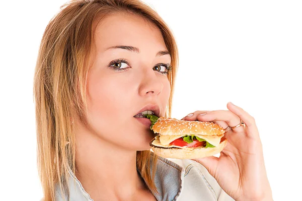 Mujer comiendo una hamburguesa —  Fotos de Stock