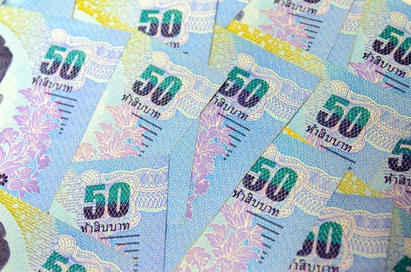 Un montón de billetes tailandeses utilizados como fondo . — Foto de Stock