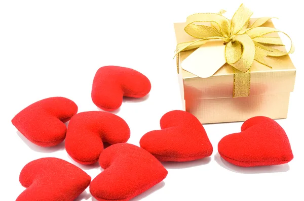 Golden gift box and red heart on white background. — Stock Photo, Image