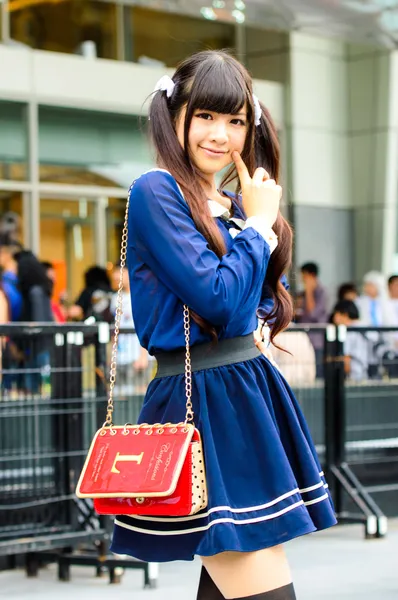 Cosplayer as Japanese schoolgirl poses in Japan Festa in Bangkok 2013. — Stock Photo, Image
