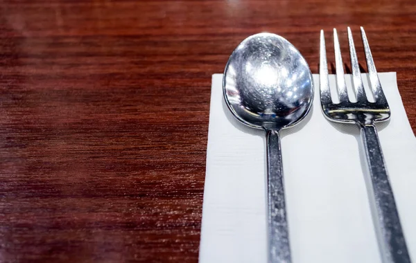 Spoon and Fork on White Napkin, Wood Background. — Stock Photo, Image