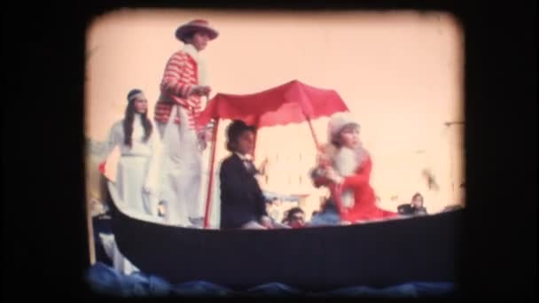 Vintage 8mm. Children in costume riding a float — Stock Video