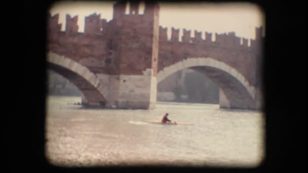 Vintage 8mm. Man kayaking against the current — Stock Video