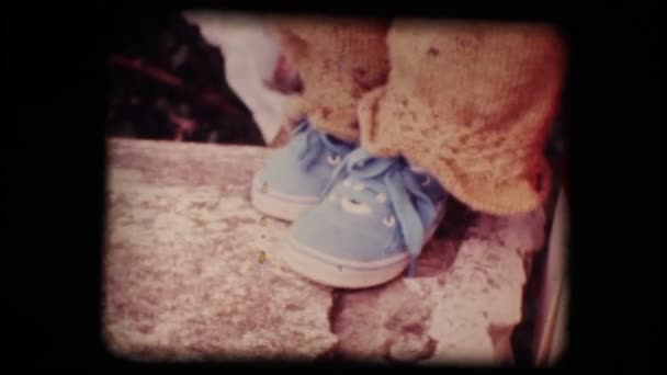 Vintage 8mm. Shoes of a little baby — Stock Video