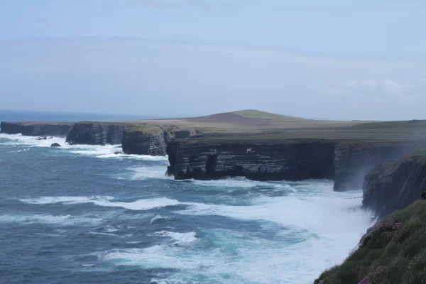 Cliffs and lapping waves, Ireland — Stock Photo, Image