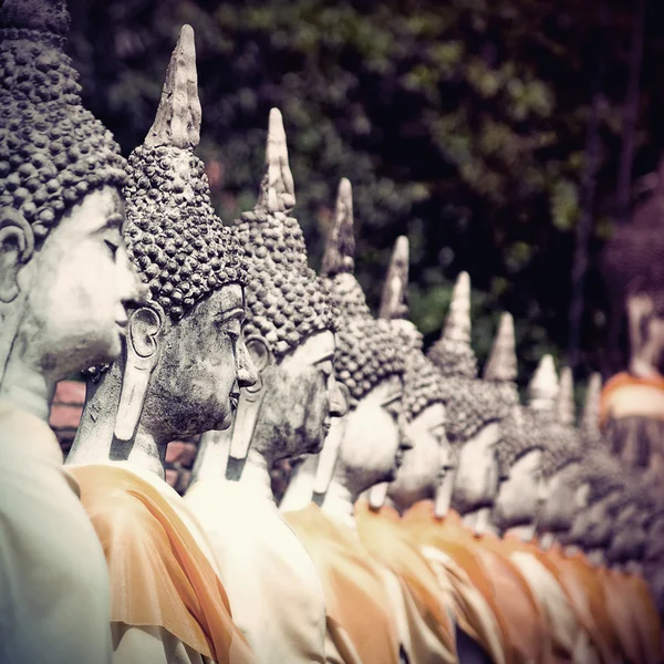 Row of Buddha statue in vintage style — Stock Photo, Image