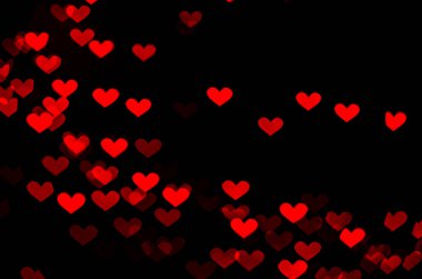 11 bokeh textures in the shape of hearts on a black background