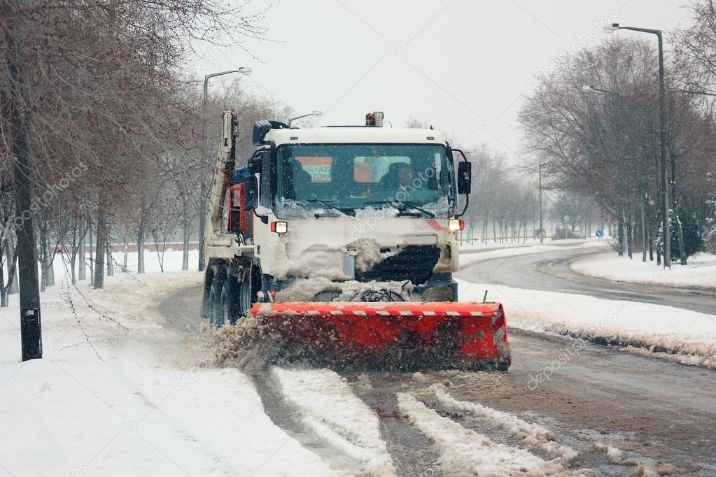 Snowplough cleaning the city streets