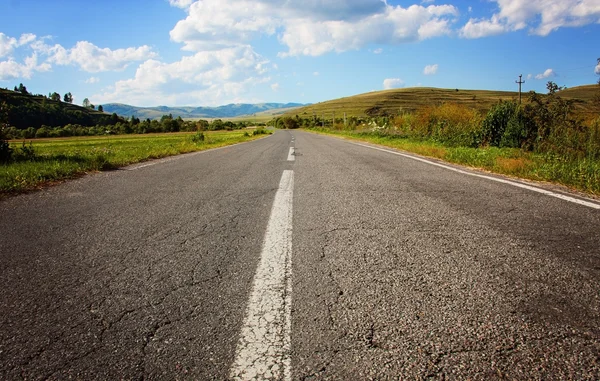Deserted road on a cloudy day — Stock Photo, Image