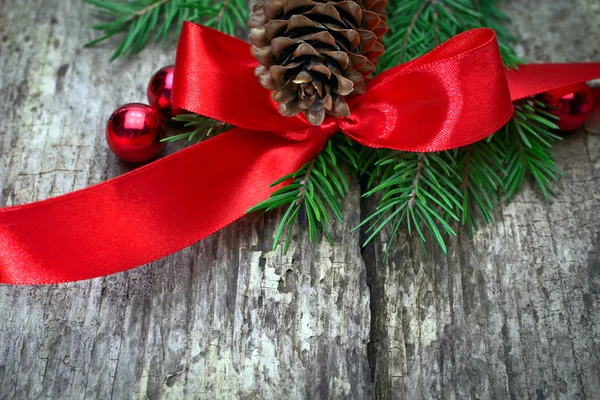 Red bow with pine cones — Stock Photo, Image