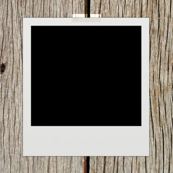 Instant photo on wood background — Stock Photo, Image