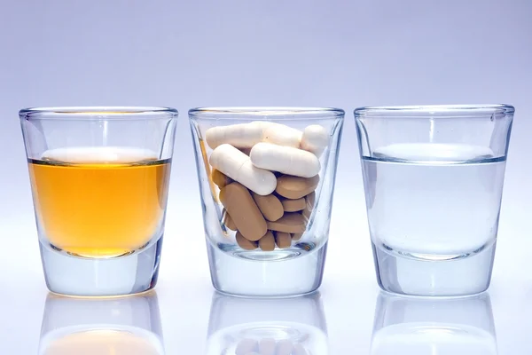 Glass with medicine and water — Stock Photo, Image