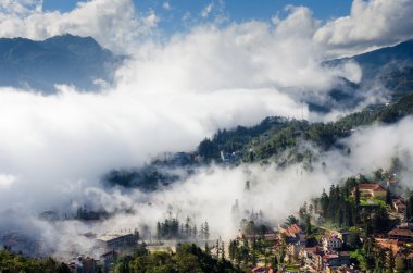 Sapa valley city in the mist in the morning, Vietnam clipart