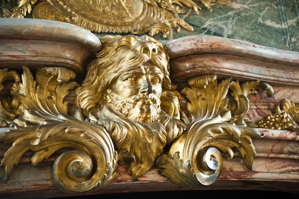 Detail of the fireplace in the Hercules Salon (or the Hercules Drawing Room) at the famous palace of Versailles, France — Stock Photo, Image