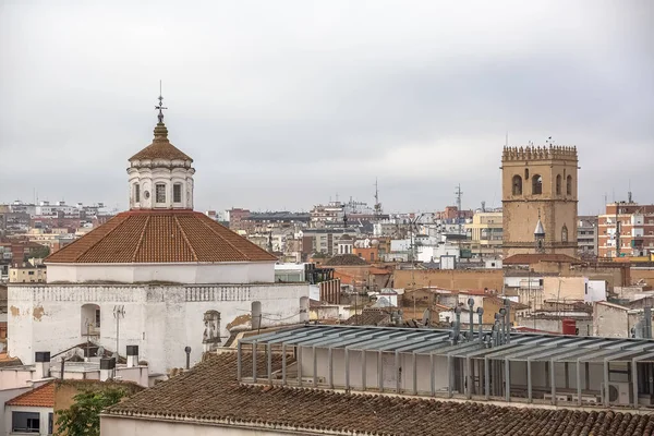 Badajoz Spain - 09 16 2021: View from the top of buildings in downtown Badajoz, cityscape, contrast between classic tower ornamented cupolas buildings and more modern buildings, Spain