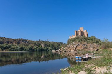 Santarem Portugal - 08 09 2022: View at the Castle of Almourol is a medieval castle atop the islet of Almourol in the middle of the Tagus River