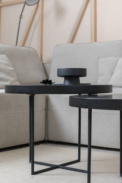 coffee table with black decor in a minimalist interior