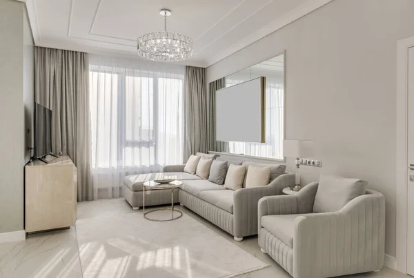Classic interior design large bright room in neutral colors with furniture and chandelier