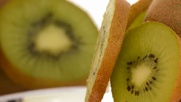 Kiwi-Fruchtscheiben rotieren. Schleife — Stockvideo