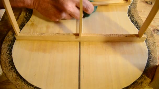 Luthier manufacturing a clasical guitar — Stock Video