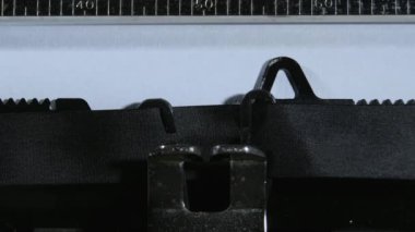 Typing the expression Fuck You with an old manual typewriter