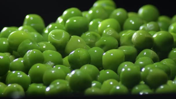 Fresh Green Peas Gyrating Black Background — Vídeo de stock