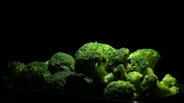 Fresh Green Broccoli Gyrating Black Background — Vídeos de Stock