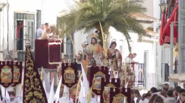 Pollinica Kardeşliği Kutsal Hafta 'da geçit töreninde. Avuç içi. Velez Malaga, Endülüs, İspanya