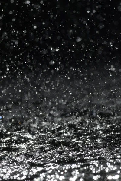 Water drops splashing and jumping with force