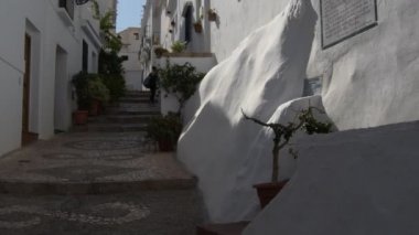 Typical andalusian whitewashed street at sunset, Frigiliana, Spain. Tilt