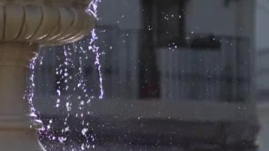 Water falling in a ancient fountain