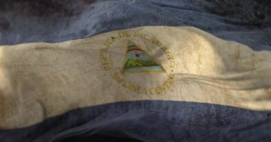 Old Nicaragua Flag waving at wind. Loop