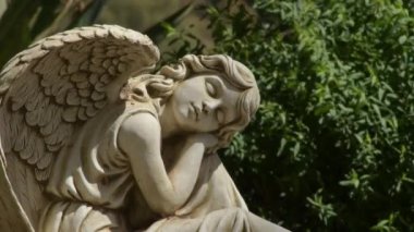 Sleeping angel statue in a cemetery, Macharaviaya, Spain